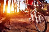 picture of fitness  - Mountain Bike cyclist riding single track at sunrise healthy lifestyle active athlete doing sport - JPG 