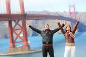 image of people  - San Francisco happy people tourist couple at Golden Gate Bridge - JPG 