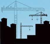 stock photo of conglomerate  - cranes over buildings  - JPG 