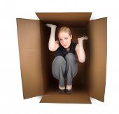 stock photo of pressure  - A business woman is trapped in a small box with anxiety on a white background - JPG 