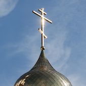 pic of religion  - Christianity religion cross on church building dome over blue sky with clouds - JPG 