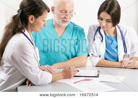 Picture or Photo of Medical theme: doctors are studying a medical report.