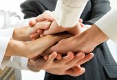 stock photo of business people  - Business people hands on top of each other - JPG 