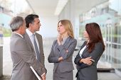stock photo of business people  - Business people meeting at an exhibition - JPG 