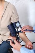 foto of bloodpressure  - Doctor measuring blood pressure - JPG 