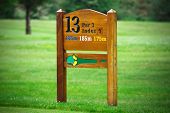 picture of golf  - 13 hole sign on golf course - JPG 