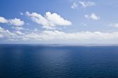 stock photo of blue sky  - Open seascape under cloudy sky - JPG 