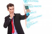 stock photo of future technology  - Young business man pushing Best Practice digital button - JPG 